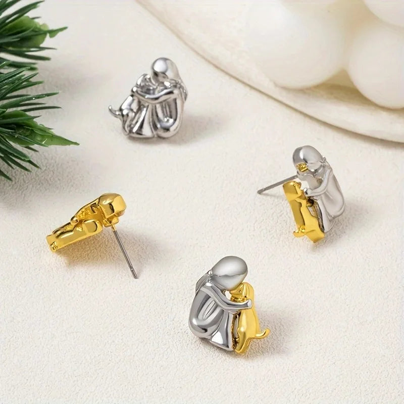 Two-Toned Earrings with a Hug in Silver and Gold in Rosendal