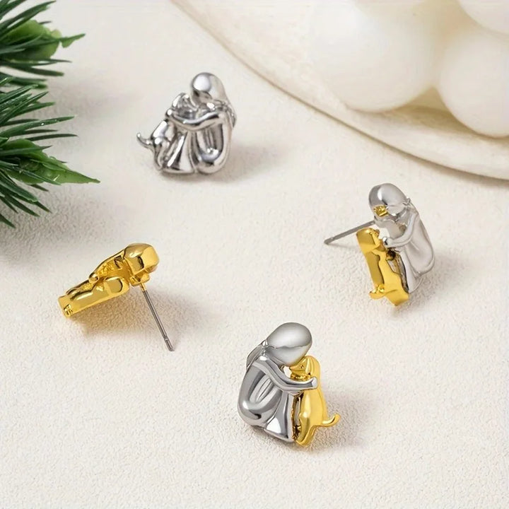 Two-Toned Earrings with a Hug in Silver and Gold in Rosendal